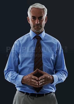 Buy stock photo Senior, businessman and portrait or serious in studio with confidence and pride for corporate career or job. Mature, entrepreneur and ceo with face, thoughtful and contemplating on black background
