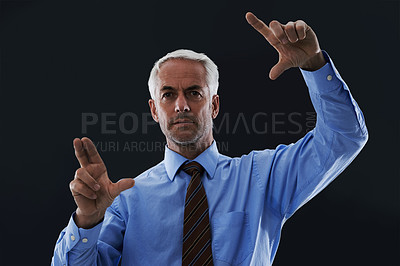 Buy stock photo Business man, hands and digital interface isolated on a black studio background. Touch, professional and finger gesture on screen, face and future innovation of technology for serious senior CEO