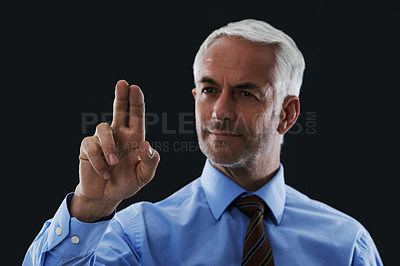 Buy stock photo Business man, finger and press interface for choice isolated on a black studio background. Touch, professional and hand gesture on screen, click and future innovation of technology for senior CEO