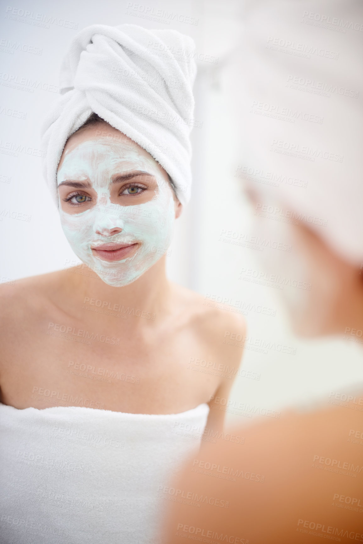 Buy stock photo Woman, portrait and facial mask in mirror for skincare, 
smile and bathroom for facial, beauty and cosmetic. Female person, towel and facemask, reflection and treatment for wellness and cleanliness