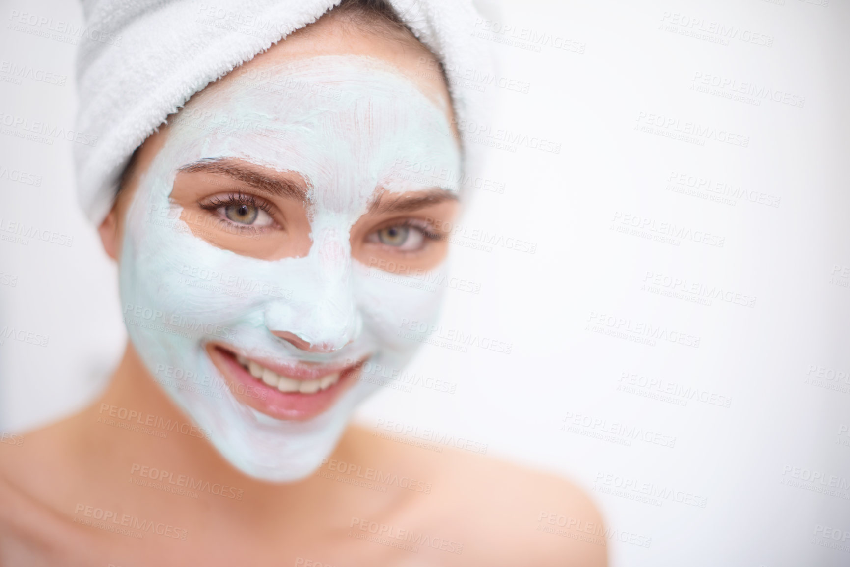 Buy stock photo Women, face mask and skin care for portrait, bathroom and acne for organic rejuvenation. Female person, towel and smile with treatment, wellness and spa day for beauty and relaxation for hygiene