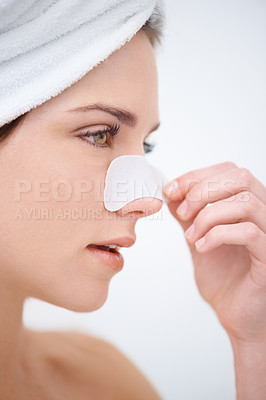 Buy stock photo A young woman with a nose strip on