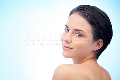 Buy stock photo Skincare, beauty space or portrait of woman in studio isolated on blue background for pride or wellness. Natural, mockup or smooth face of confident model or female person with shine or facial glow 