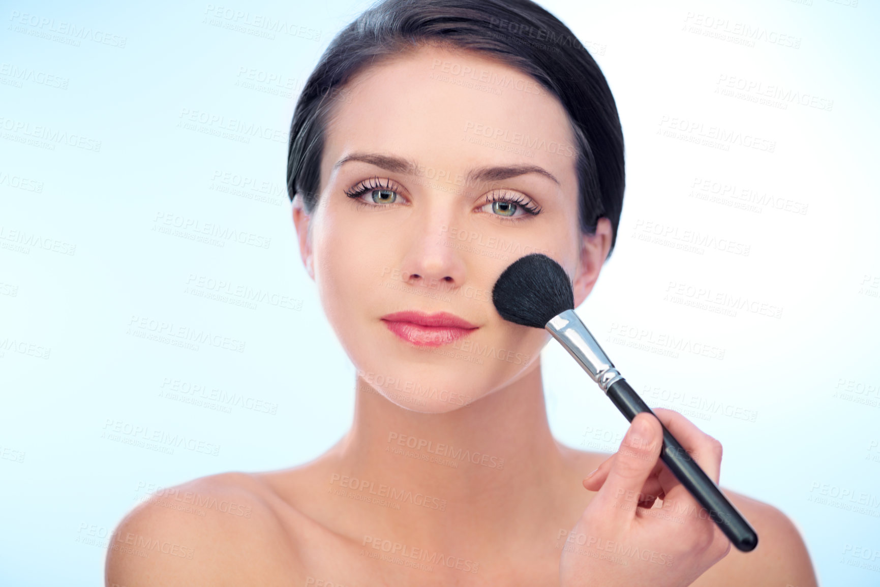 Buy stock photo Woman, portrait and makeup brushes in studio with cosmetic, beauty tools or product application for skincare. Model, face and confidence with skin wellness, cosmetology or grooming on blue background