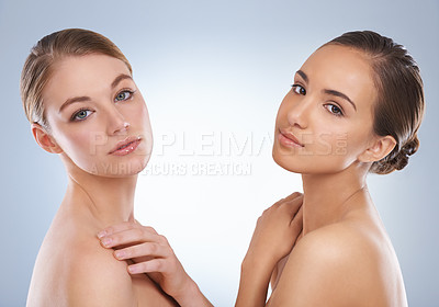 Buy stock photo Woman, portrait and models in skincare with beauty, makeup or cosmetics on a blue studio background. Young female person or people with diversity in facial treatment, spa or salon on mockup space