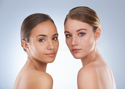Buy stock photo Happy woman, portrait and skincare with beauty, makeup or cosmetics on a blue studio background. Young female, people or models posing with different skin tone for facial treatment, spa or hair salon