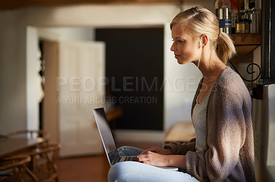 Buy stock photo Remote work, laptop and woman reading in a house for research, planning or web communication. Freelance, typing and female person in living room with online editing, writing or checking social media