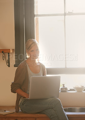 Buy stock photo Woman, freelancer and laptop in portrait, remote work and internet connection in kitchen for info. Female person, editor and website for research or online news, blog and typing an article on tech