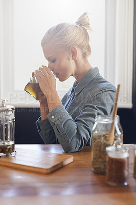 Buy stock photo Woman, brewing and home with herbal tea in kitchen with plunger, jug and ingredients for healthy and warm beverage. Home herbs, morning and fresh to taste, drink and enjoy before day at work. 