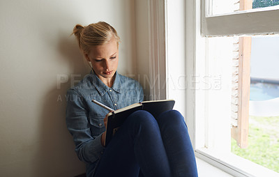 Buy stock photo Woman, window and writing ideas in notebook, planning and brainstorming or reminder for schedule at home. Female person, information and journal for inspiration, author and notes in diary for project