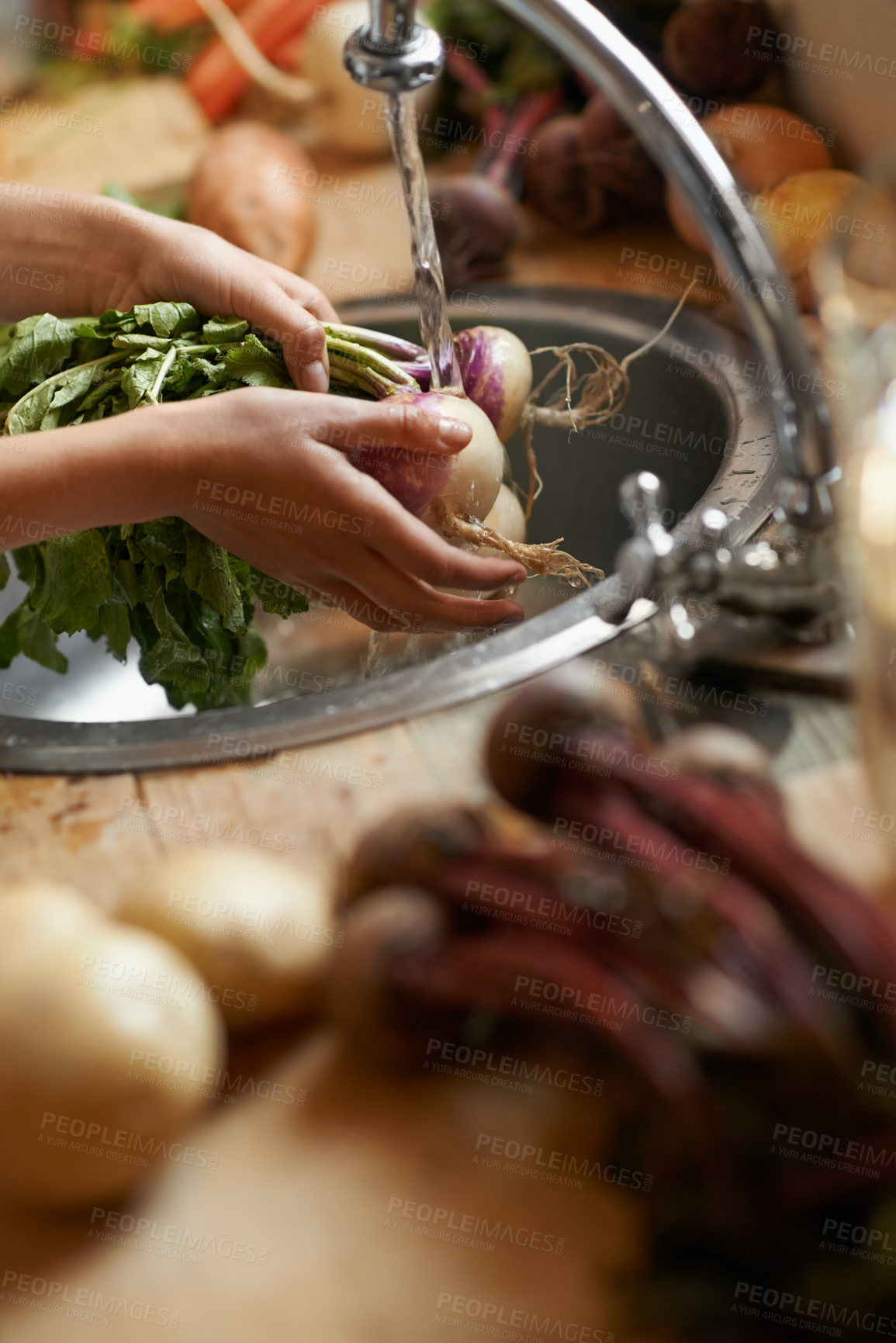 Buy stock photo Washing, vegetables and hands in kitchen for healthy food, hygiene and cooking or preparation by sink. Person with water, liquid and onion for meal, dinner or organic, vegan and vegetarian lunch