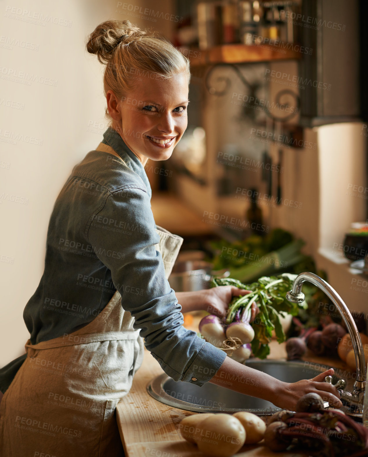 Buy stock photo Woman, portrait and washing of vegetables and healthy food for hygiene, cooking or preparation by sink in kitchen. Happy person with water and green onion to start dinner or organic and vegan lunch