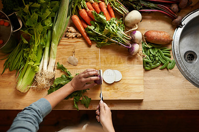 Buy stock photo Top view, vegetables and chopping board with hands, cutting and prepare healthy meal. Hand, knife or kitchen utensils with vegan diet, nutrition and organic ingredients with vegetarian dinner at home