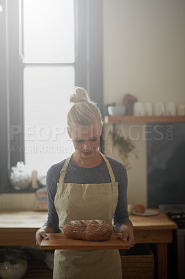 Buy stock photo Bakery, kitchen and woman with bread on tray for cooking with healthy gluten free food for breakfast. Fresh, loaf and chef in restaurant with rye or sourdough for brunch, meal or lunch with nutrition