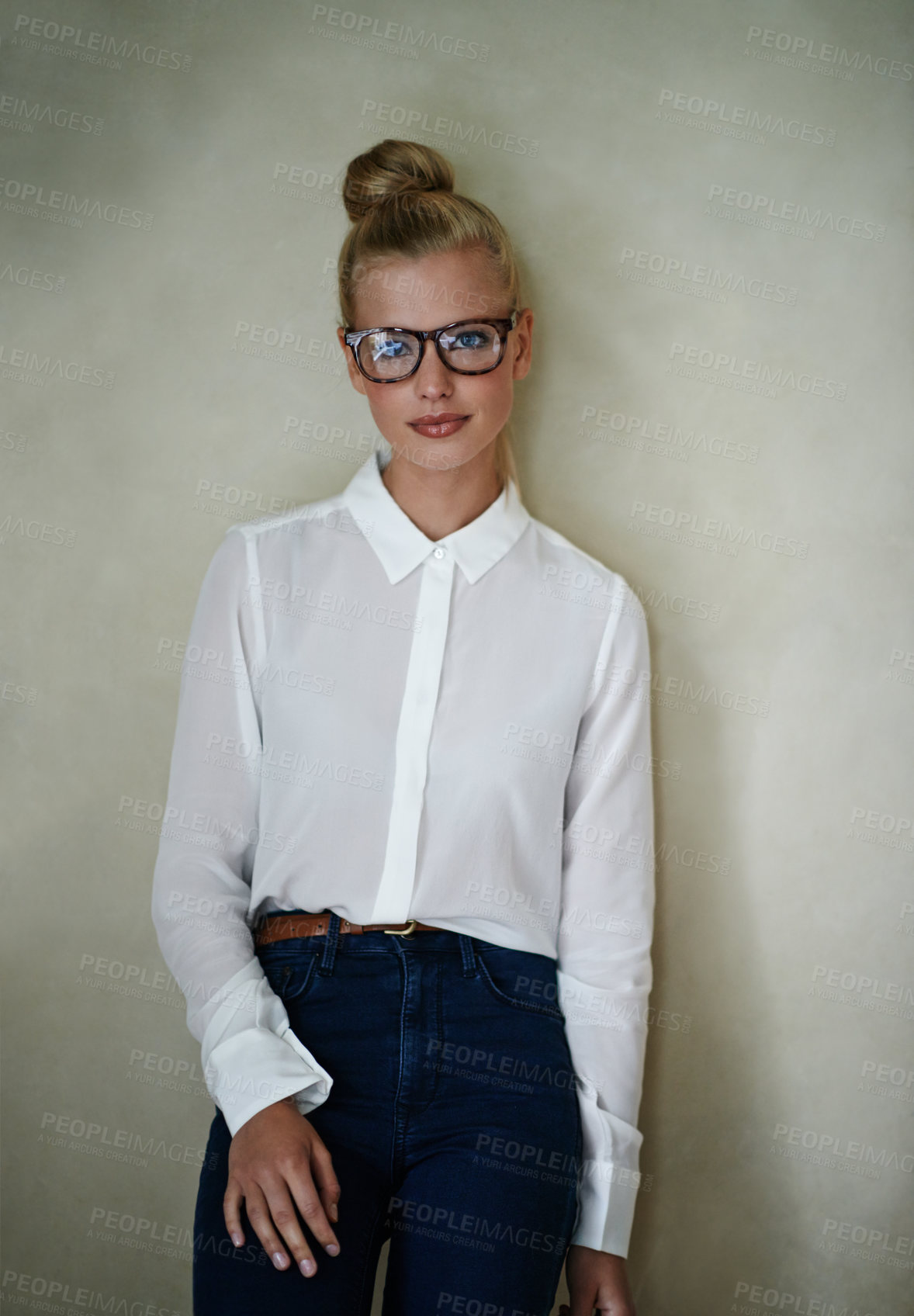 Buy stock photo Portrait, young woman and fashion in blouse with spectacles and hair in a bun. Female person model with blonde up do with smart casual style clothes in studio as small business entrepreneur 