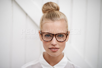 Buy stock photo A young woman wearing a blouse and spectacles