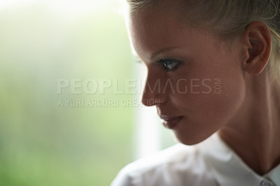 Buy stock photo Thinking, window and face of woman with memory, reflection and planning expression by mockup. Brainstorming, ideas and closeup of young female person with wonder at apartment with mock up space.