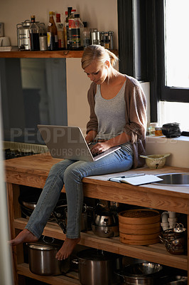 Buy stock photo Woman in kitchen, laptop and remote work, typing for blog with freelancer and copywriting. Working from home, website development and writing article with technology and copywriter research online