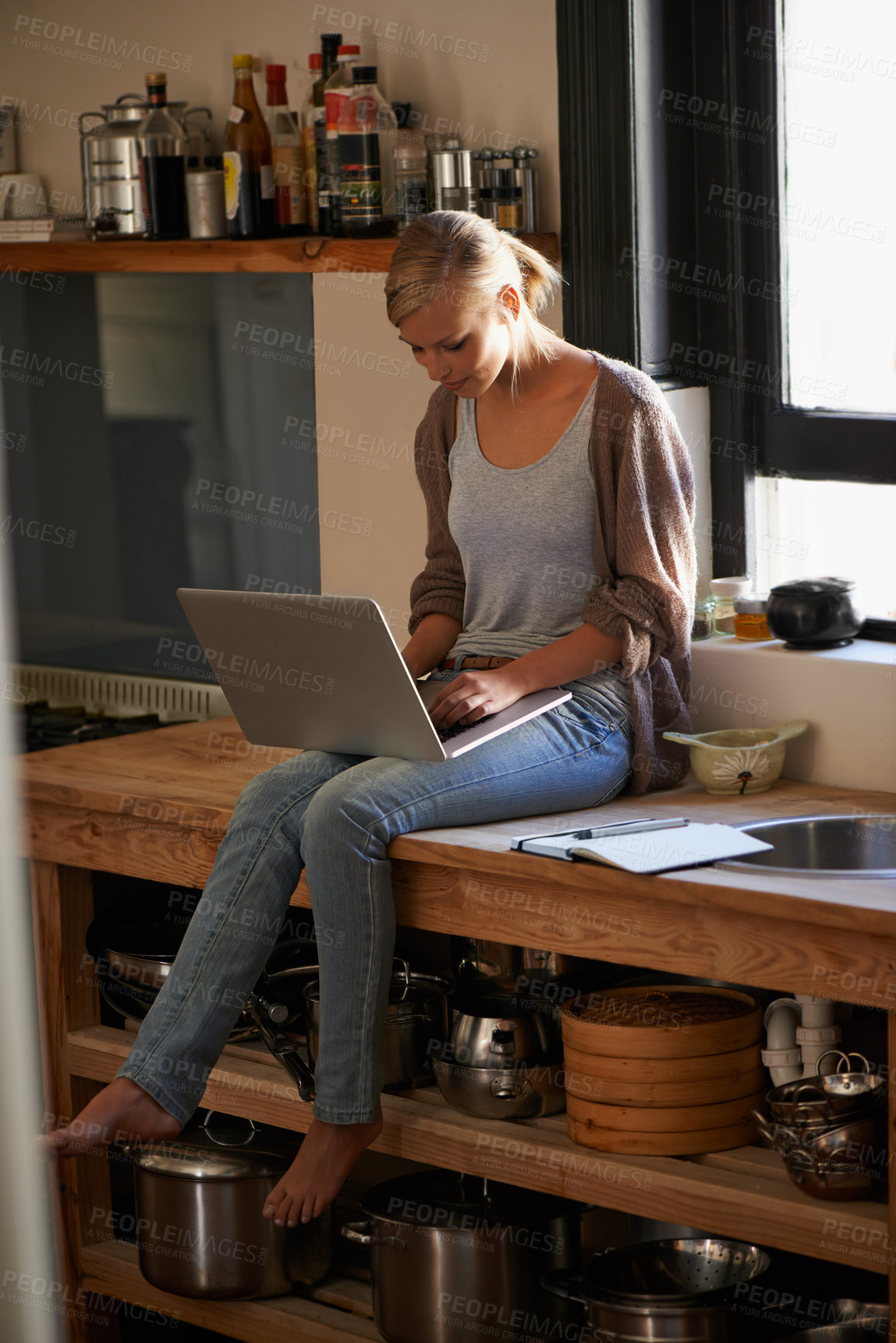 Buy stock photo Woman in kitchen, laptop and remote work, typing for blog with freelancer and copywriting. Working from home, website development and writing article with technology and copywriter research online
