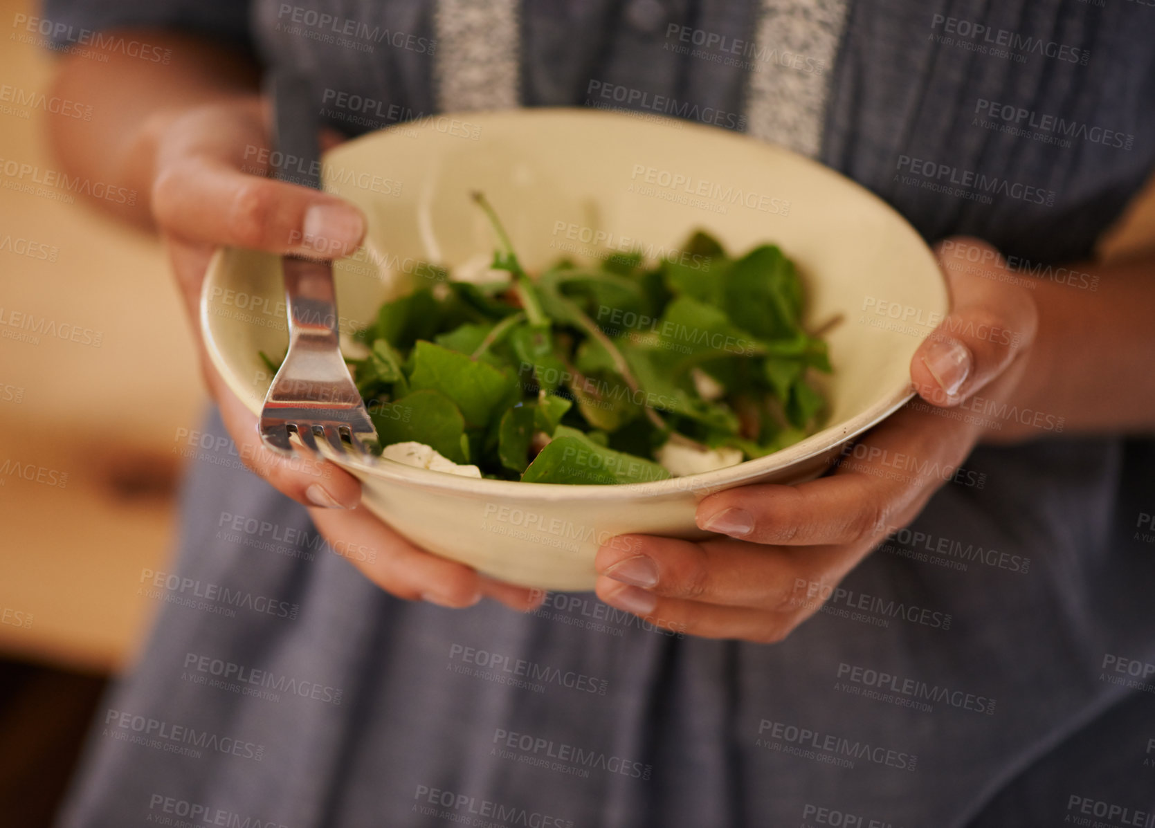 Buy stock photo Hands, salad bowl and lettuce for healthy nutrition with vegetables in kitchen or recipe, wellness or hungry. Person, fingers and fork for organic eating or leafy greens for ingredients, dish or meal