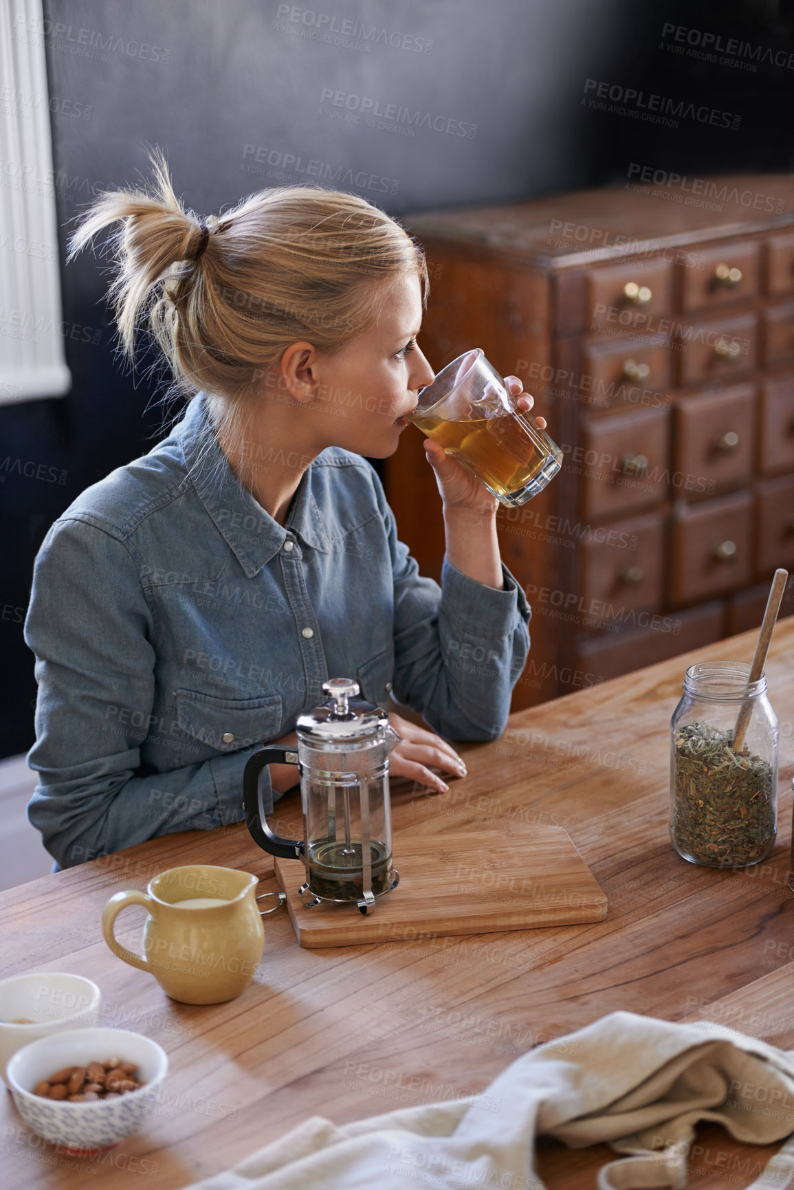 Buy stock photo A young woman drinking herbal tea