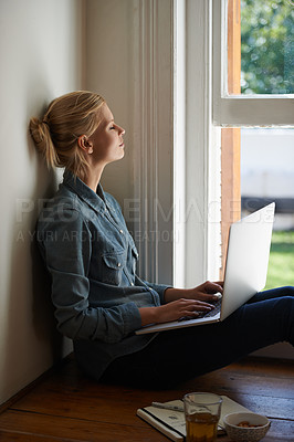 Buy stock photo Woman, freelancer and laptop by window, writer and internet connection on floor for info. Female person, editor and website for research or online news, blogging and typing an article on technology