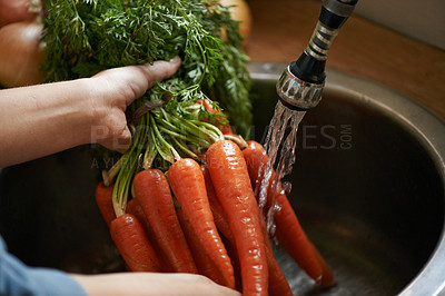 Buy stock photo Carrot, water and cleaning vegetables with hands in kitchen, hygiene and health with chef cooking food. Nutrition, person with vegan or vegetarian meal, wash produce at sink for catering and dinner 