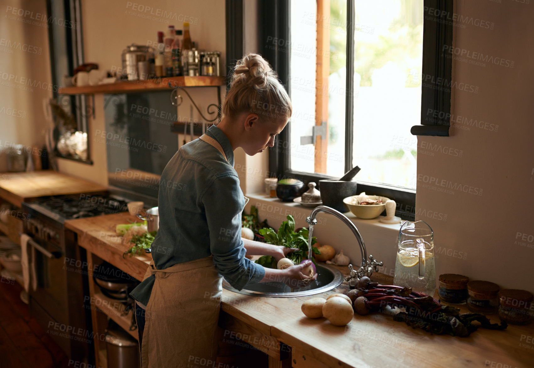 Buy stock photo Woman, chef and washing food for hygiene in the kitchen sink at home for cooking. Female person, prepare and cleaning vegetables for meal and nutrition or rising in water for a healthy diet 