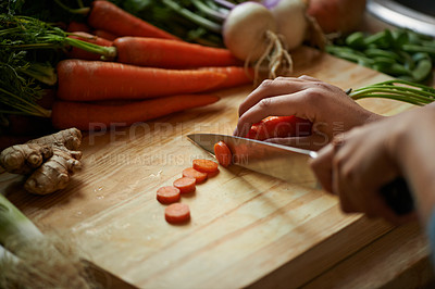 Buy stock photo Vegetables, hands and person with knife and carrot cut and for cooking lunch and nutrition diet at home. Wellness, health and organic food with meal, vegetarian and ingredients for salad in a kitchen