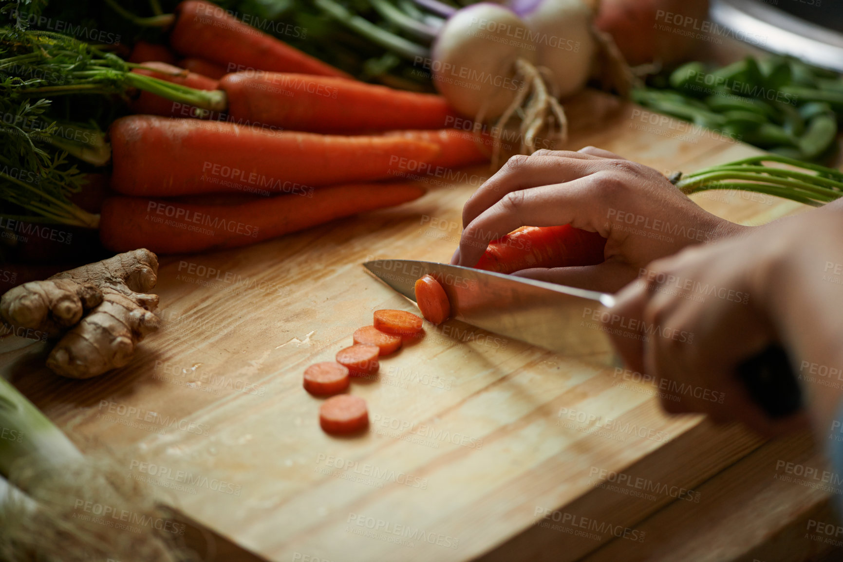 Buy stock photo Vegetables, hands and person with knife and carrot cut and for cooking lunch and nutrition diet at home. Wellness, health and organic food with meal, vegetarian and ingredients for salad in a kitchen