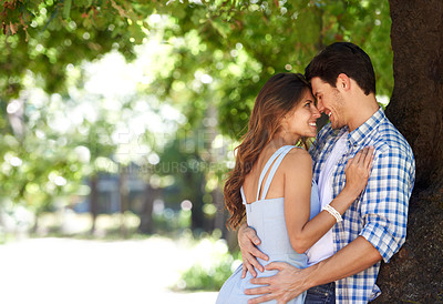 Buy stock photo Love, hug and happy with couple in park for romance, bonding and summer vacation. Happiness, commitment and relax with man and woman embrace on date in nature for funny, support and relationship