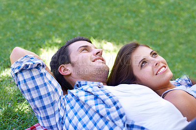 Buy stock photo Couple, smile and relax on grass for connection, bonding and love in park outdoors. Happy, man and woman in summer for holiday, vacation or date for healthy relationship in field with closeup
