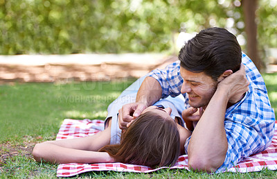 Buy stock photo Love, picnic and couple on blanket at the park on a romantic date and lying on grass. Summer, happy partners and relax on vacation, anniversary or outdoor in nature sunshine for valentines day 