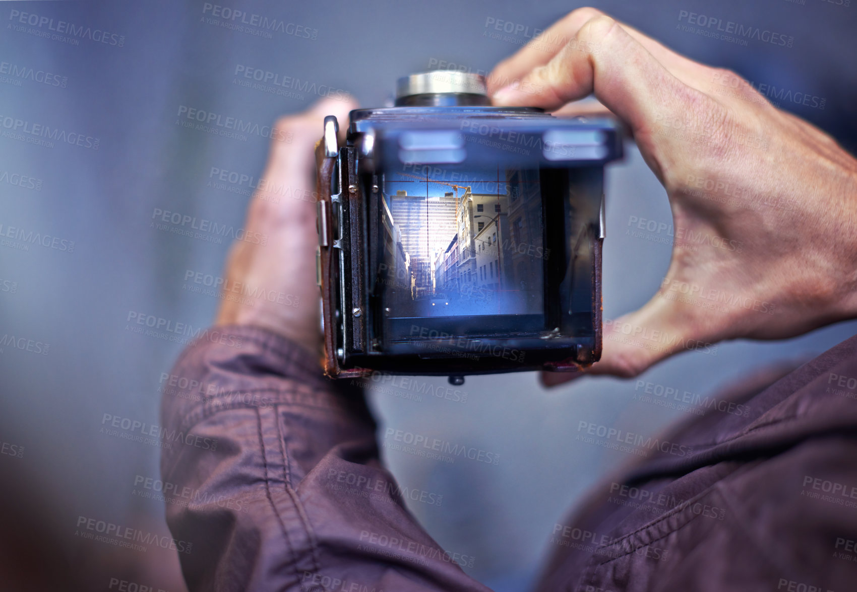 Buy stock photo Vintage, camera and photography on screen in hands of person with photoshoot in city to film street. Travel, photographer and creative cameraman closeup with retro lens to capture urban media outdoor