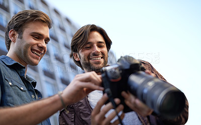 Buy stock photo Men, friends and photographer with digital camera in urban, streets and town with media for portfolio in London. Collaboration, creativity and photography in city to build profile for project. 