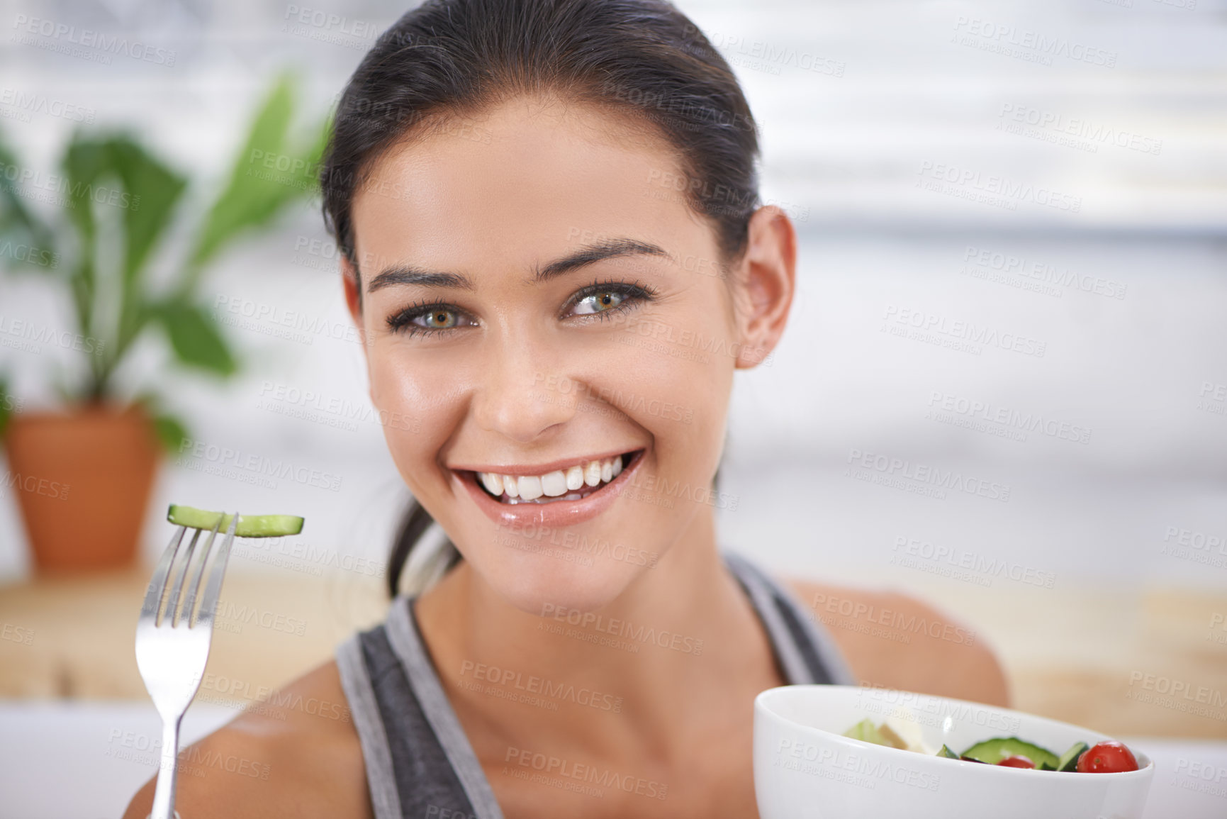 Buy stock photo A young woman holding a bowl of salad