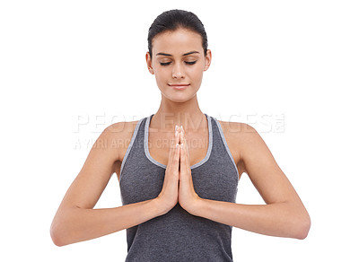 Buy stock photo A young woman meditating isolated on white