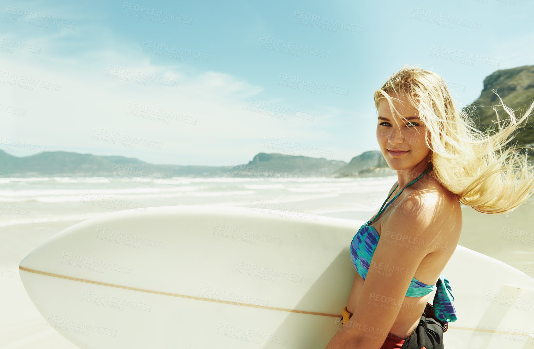 Buy stock photo Portrait, wind and woman on beach with surfboard in summer for sports, travel or vacation on coast. Face, fitness and happy young surfer person on sand by sea or ocean for surfing hobby or leisure