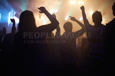Buy stock photo Lights, energy and people dancing at music festival from back, night and silhouette at live concert event. Dance, fun and group of excited fans in arena at rock band performance or crowd at party.
