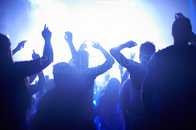 Buy stock photo Blue, neon lights and people dancing at music festival from back, lighting and energy at live concert event. Dance, fun and group of excited fans in arena at rock band performance or crowd at party.