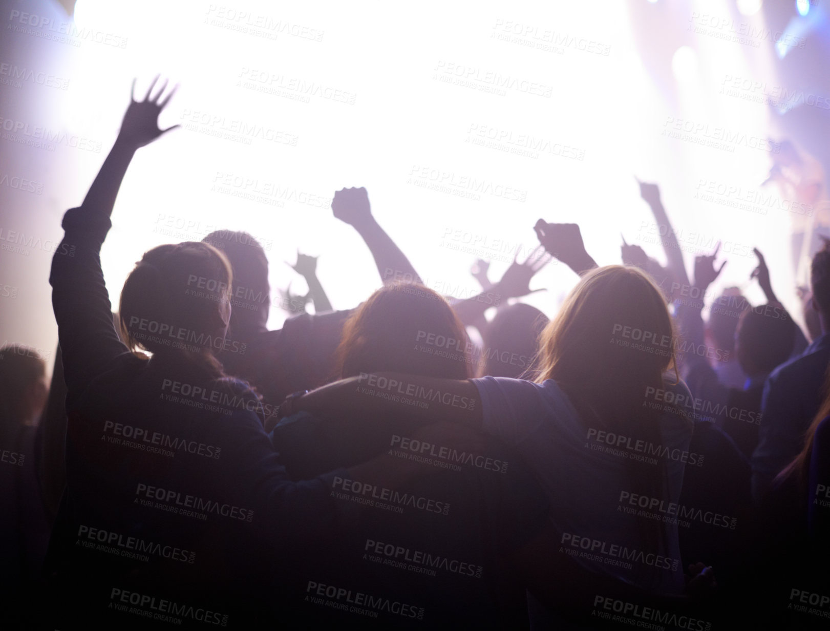 Buy stock photo Group of people dancing at music festival from back, lights and energy at live concert event. Dance, fun and crowd of excited fans in arena at rock band performance or audience at party in silhouette