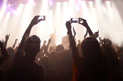 Buy stock photo Music, festival and hands of audience with phone for pictures, celebration and enjoying night, concert or event. Party, people and performance with excited fans showing support, passion and recording