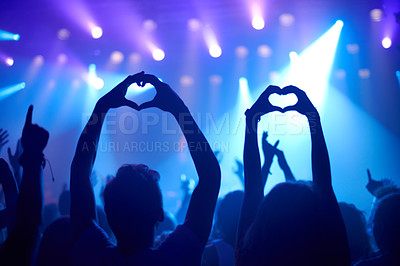 Buy stock photo Shot of adoring fans at a rock concert