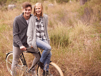Buy stock photo Couple, portrait and field with retro bicycle on holiday, adventure or date with sustainable transport. Man, woman and vintage bike with smile for vacation with journey in nature, path or environment