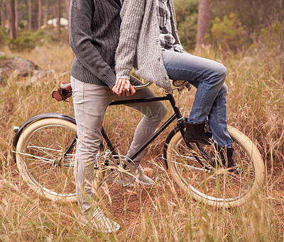 Buy stock photo Couple, outdoor and bike with handlebars for carrying person for adventure, vacation or sustainability. People, retro bicycle and nature and path for cycling journey on holiday with ecology in woods