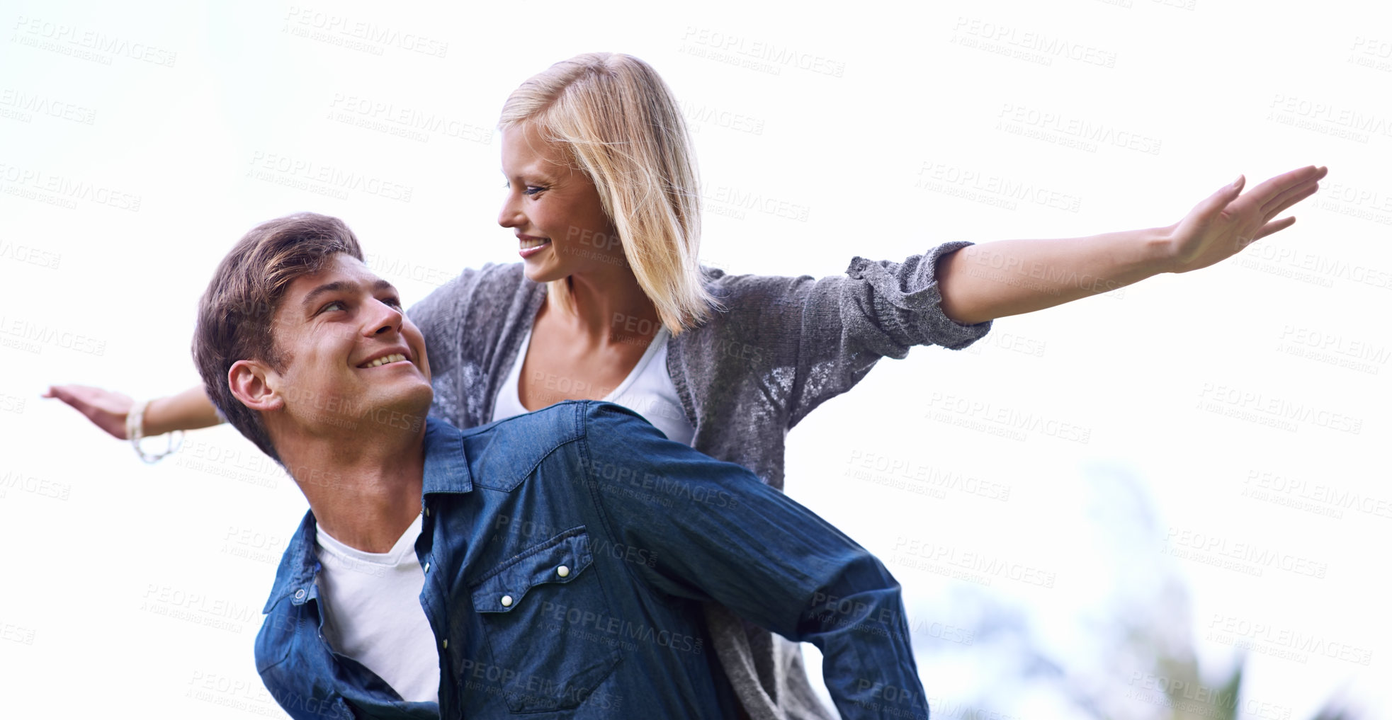 Buy stock photo Couple, piggy back and plane with arms, smile or game by trees with care for connection with bonding outdoor. Man, woman and playful with airplane, wings or flight for freedom on journey for vacation