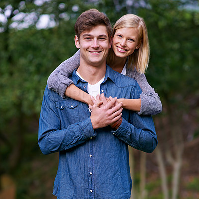 Buy stock photo Couple, portrait and happy with hug in nature or countryside for holiday, vacation or anniversary getaway. Love, man and woman with face, smile and embrace in woods or forest for relationship or care