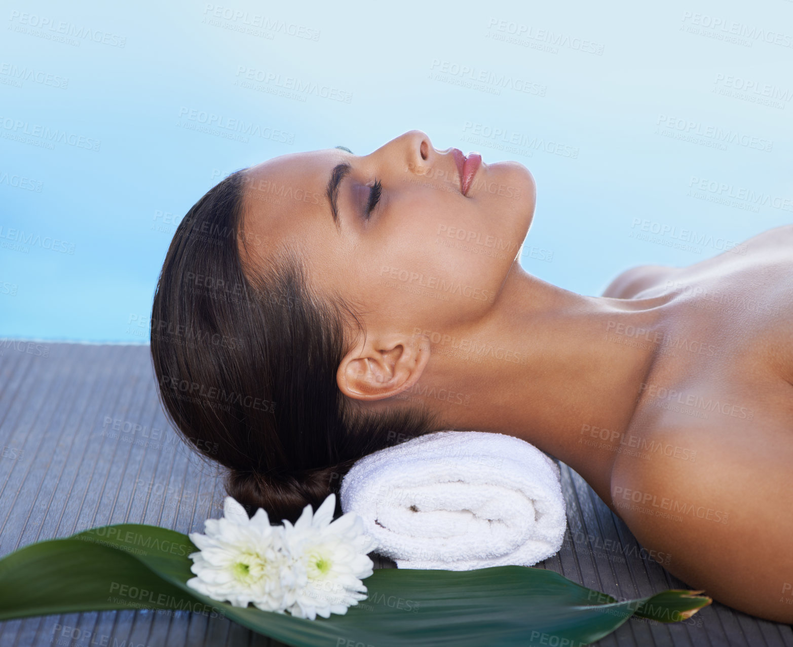 Buy stock photo A beautiful woman relaxing by the pool