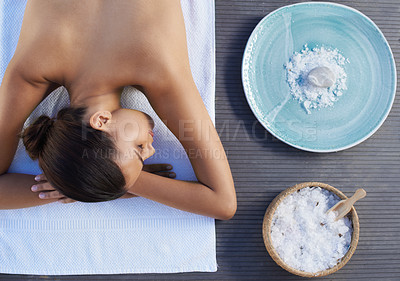 Buy stock photo Sleeping, salt or woman in spa or resort with bowl for wellness, treatment or hospitality. Relax, top or healing therapy for happy person, client or masseuse in hotel on break or holiday vacation