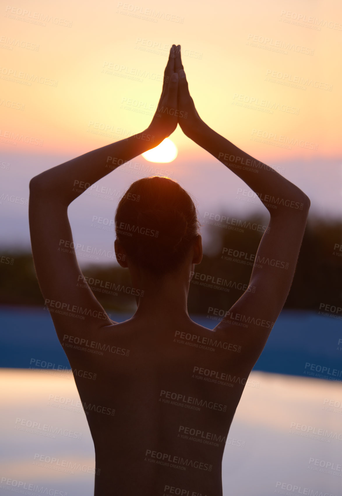 Buy stock photo Tree, yoga and woman meditate at sunset by swimming pool for healthy body, wellness and zen outdoor. Rear view, vrikshasana pose and person at water at twilight to relax, peace or calm for balance